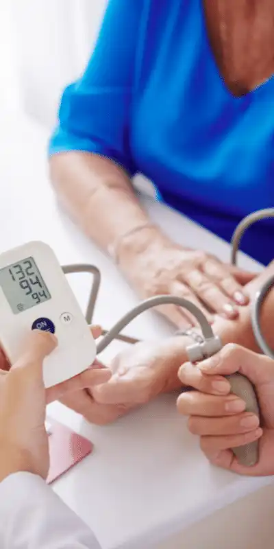 Patient getting blood pressure checked at home