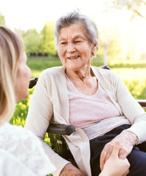 Woman-in-wheelchair-with-carer-portrait.png